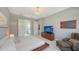 Bright bedroom with ensuite bathroom access and TV at 10656 Glencorse Ter, Bradenton, FL 34211