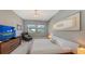 Spacious bedroom with large windows and comfortable seating at 10656 Glencorse Ter, Bradenton, FL 34211