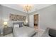 Guest bedroom with a queen bed and en-suite bathroom at 10656 Glencorse Ter, Bradenton, FL 34211