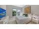 Cozy bedroom with TV and large window views at 10656 Glencorse Ter, Bradenton, FL 34211