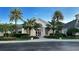 Attractive community clubhouse with lush landscaping and palm trees at 10656 Glencorse Ter, Bradenton, FL 34211