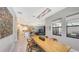Open concept dining area with modern light fixture and kitchen view at 10656 Glencorse Ter, Bradenton, FL 34211