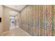 Bright hallway with large-scale art and tile flooring at 10656 Glencorse Ter, Bradenton, FL 34211