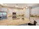 Spacious kitchen with granite countertops and white cabinets at 10656 Glencorse Ter, Bradenton, FL 34211