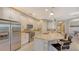 Modern kitchen with stainless steel appliances and an island at 10656 Glencorse Ter, Bradenton, FL 34211