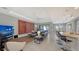 Spacious living room with sectional sofa, large TV, and open floor plan at 10656 Glencorse Ter, Bradenton, FL 34211