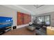 Living room features a large TV, sectional sofa, and artwork at 10656 Glencorse Ter, Bradenton, FL 34211