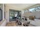 Modern outdoor kitchen with stainless steel appliances and dining area at 10656 Glencorse Ter, Bradenton, FL 34211