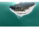 Aerial view of Anna Maria Island, showcasing waterfront homes and beach at 112 Maple Ave, Anna Maria, FL 34216