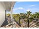 Private balcony with neighborhood and water views at 112 Maple Ave, Anna Maria, FL 34216