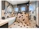 Elegant bathroom with a freestanding tub, walk-in shower, and geometric tile at 112 Maple Ave, Anna Maria, FL 34216