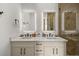 Modern bathroom with double vanity and large shower at 112 Maple Ave, Anna Maria, FL 34216