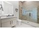 Modern bathroom with walk-in shower and floating vanity at 112 Maple Ave, Anna Maria, FL 34216