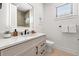 Modern bathroom with a beige tile shower and floating vanity at 112 Maple Ave, Anna Maria, FL 34216