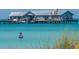 Personal fishing in shallow water near a pier at 112 Maple Ave, Anna Maria, FL 34216