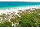 Aerial view of beach with people and umbrellas at 112 Maple Ave, Anna Maria, FL 34216