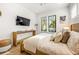 Bright bedroom with a king-size bed and built-in media console at 112 Maple Ave, Anna Maria, FL 34216