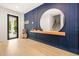 Bright entryway with modern wood and blue accents at 112 Maple Ave, Anna Maria, FL 34216