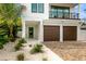 Front view of the home, featuring a walkway and landscaping at 112 Maple Ave, Anna Maria, FL 34216