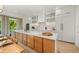 Modern kitchen with white cabinets, quartz countertops and stainless steel appliances at 112 Maple Ave, Anna Maria, FL 34216