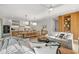 Open concept kitchen and dining area with modern appliances and a large island at 112 Maple Ave, Anna Maria, FL 34216
