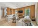Bright living room with comfy sofas, a coffee table, and built-in shelving at 112 Maple Ave, Anna Maria, FL 34216