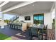 Outdoor dining area with table and chairs on deck at 112 Maple Ave, Anna Maria, FL 34216