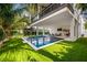 Enjoy this refreshing pool and spacious backyard at 112 Maple Ave, Anna Maria, FL 34216