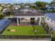 Large rooftop deck with putting green and seating at 112 Maple Ave, Anna Maria, FL 34216
