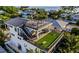 Spacious rooftop deck with artificial turf, seating, and a grill at 112 Maple Ave, Anna Maria, FL 34216