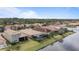 Community overview, showcasing homes and a lake at 11550 Blackfin St, Venice, FL 34292