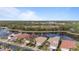 Community overview, showcasing homes and a lake at 11550 Blackfin St, Venice, FL 34292