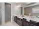 Elegant bathroom with double vanity, soaking tub, and walk-in shower at 11550 Blackfin St, Venice, FL 34292