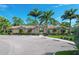 Community clubhouse with palm trees and parking at 11550 Blackfin St, Venice, FL 34292