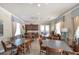 Community room with tables, chairs, and a kitchenette at 11550 Blackfin St, Venice, FL 34292