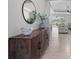 Stylish entryway featuring a mid-century modern console table and mirror at 11550 Blackfin St, Venice, FL 34292