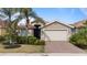 Single-story home with a two-car garage and manicured landscaping at 11550 Blackfin St, Venice, FL 34292