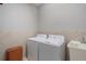Clean laundry room with washer, dryer, and utility sink at 11550 Blackfin St, Venice, FL 34292