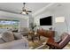 Spacious living room with comfortable seating and a large TV at 11550 Blackfin St, Venice, FL 34292