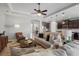 Open concept living room and kitchen with neutral tones at 11550 Blackfin St, Venice, FL 34292