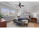 Spacious main bedroom with ceiling fan and large windows at 11550 Blackfin St, Venice, FL 34292