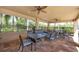 Covered patio with seating and ceiling fans at 11550 Blackfin St, Venice, FL 34292