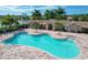 Freeform community pool with surrounding patio at 11550 Blackfin St, Venice, FL 34292