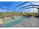 Relaxing screened-in pool and spa with lake view at 11550 Blackfin St, Venice, FL 34292