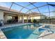 Large pool and spa with patio and screened enclosure at 11550 Blackfin St, Venice, FL 34292