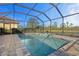 Enjoy this refreshing pool and spa with a screened enclosure at 11550 Blackfin St, Venice, FL 34292