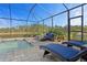 Pool area with lounge chairs and relaxing seating area at 11550 Blackfin St, Venice, FL 34292
