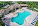 Community pool with lounge chairs and patio area at 11550 Blackfin St, Venice, FL 34292