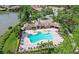 Community pool and clubhouse with lake views at 11550 Blackfin St, Venice, FL 34292
