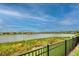 Peaceful lake view from this fenced backyard at 11786 Sistine Ln, Venice, FL 34293